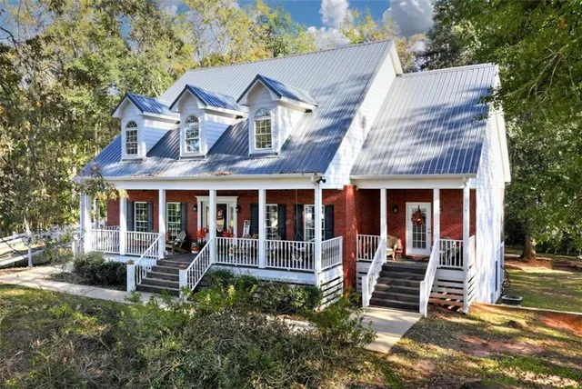 a view of a hallway with wooden floor and stairs