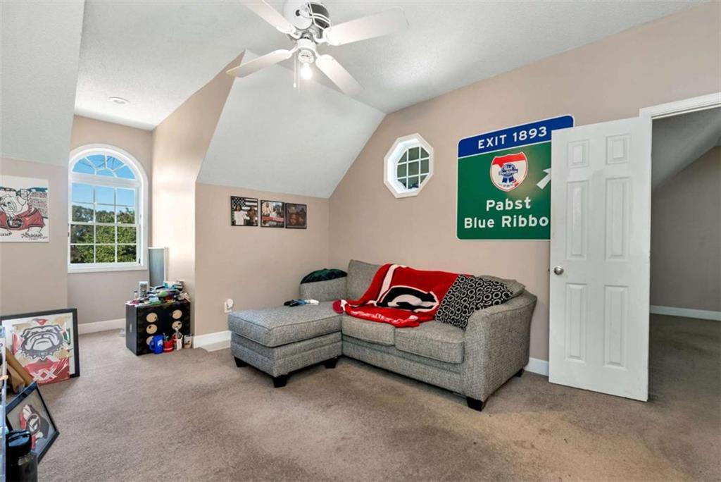 51 Howiington Road Jefferson, GA 30549 - Photo 34 of 81 a living room with furniture and a window