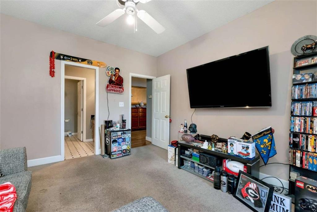 51 Howiington Road Jefferson, GA 30549 - Photo 35 of 81 a room with furniture and a flat screen tv