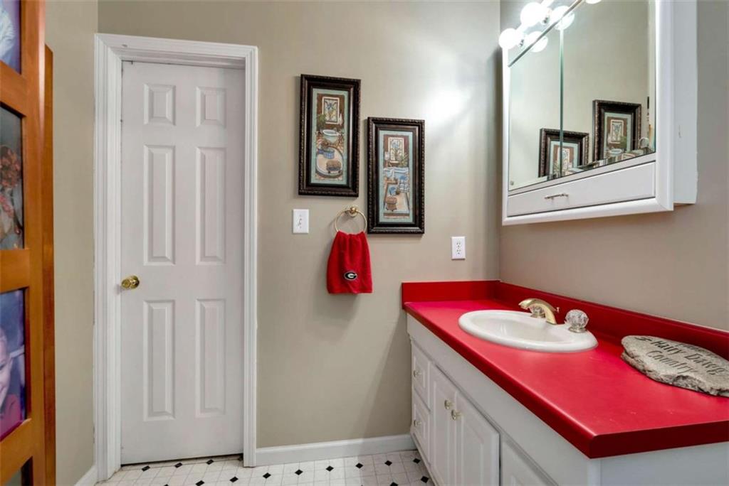 51 Howiington Road Jefferson, GA 30549 - Photo 41 of 81 a bathroom with a sink vanity and mirror