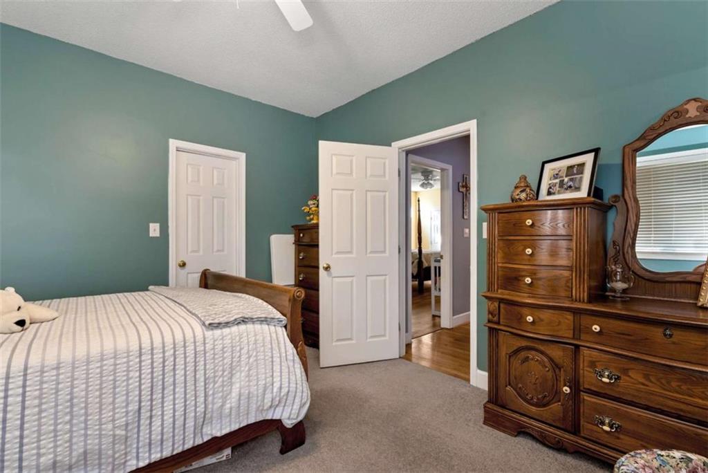 51 Howiington Road Jefferson, GA 30549 - Photo 42 of 81 a bedroom with a bed and a dresser