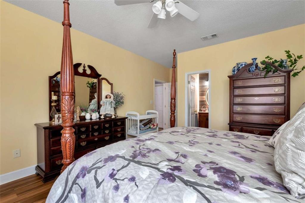 51 Howiington Road Jefferson, GA 30549 - Photo 44 of 81 a bedroom with a bed and a dresser