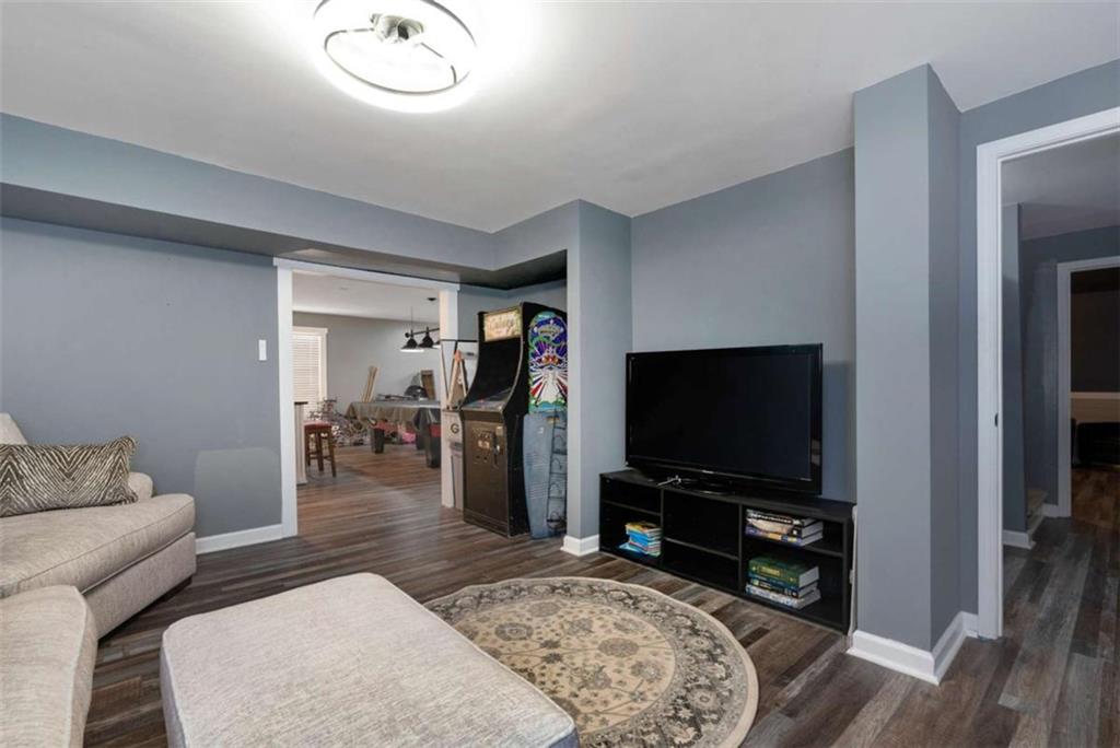 51 Howiington Road Jefferson, GA 30549 - Photo 47 of 81 a living room with furniture and a flat screen tv