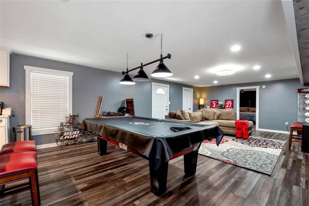51 Howiington Road Jefferson, GA 30549 - Photo 48 of 81 a living room with furniture kitchen view and a wooden floor