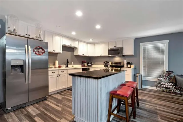 a view of a yard with wooden fence