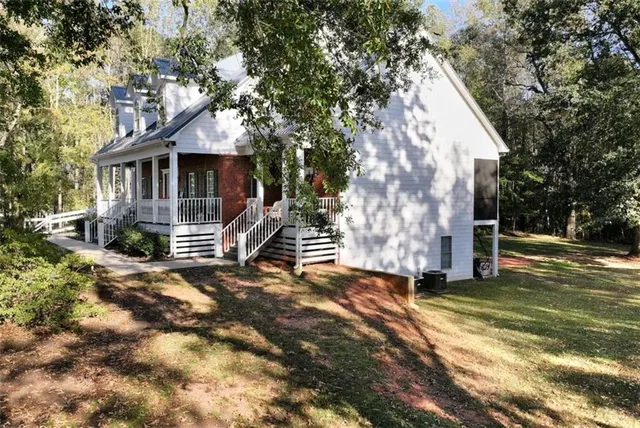 a room with dining table and chairs