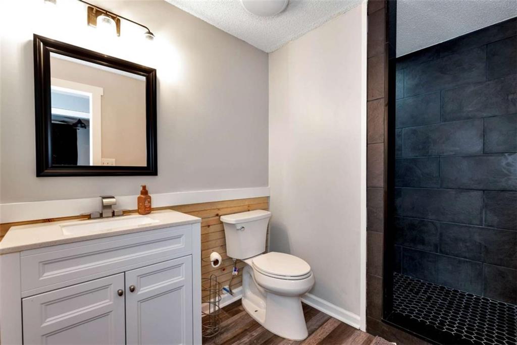 51 Howiington Road Jefferson, GA 30549 - Photo 60 of 81 a bathroom with a toilet sink and mirror