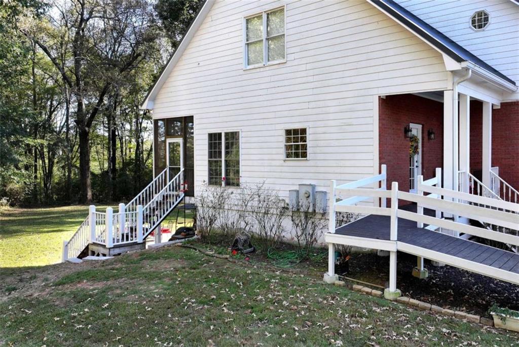 51 Howiington Road Jefferson, GA 30549 - Photo 67 of 81 a view of a house with a backyard