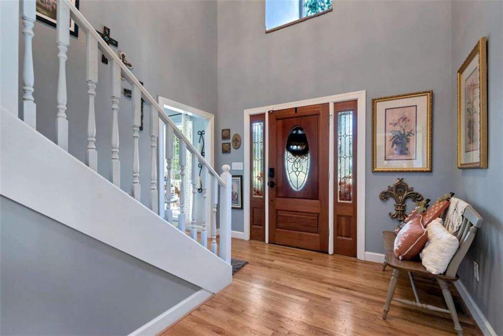 51 Howiington Road Jefferson, GA 30549 - Photo 7 of 81 a view of a hallway with wooden floor and stairs
