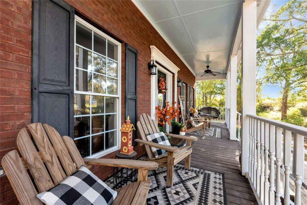 51 Howiington Road Jefferson, GA 30549 - Photo 72 of 81 a view of balcony with chairs and wooden fence
