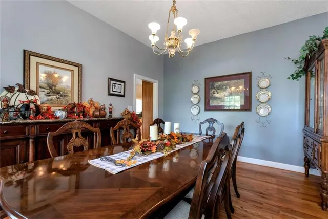a kitchen with granite countertop a sink and cabinets
