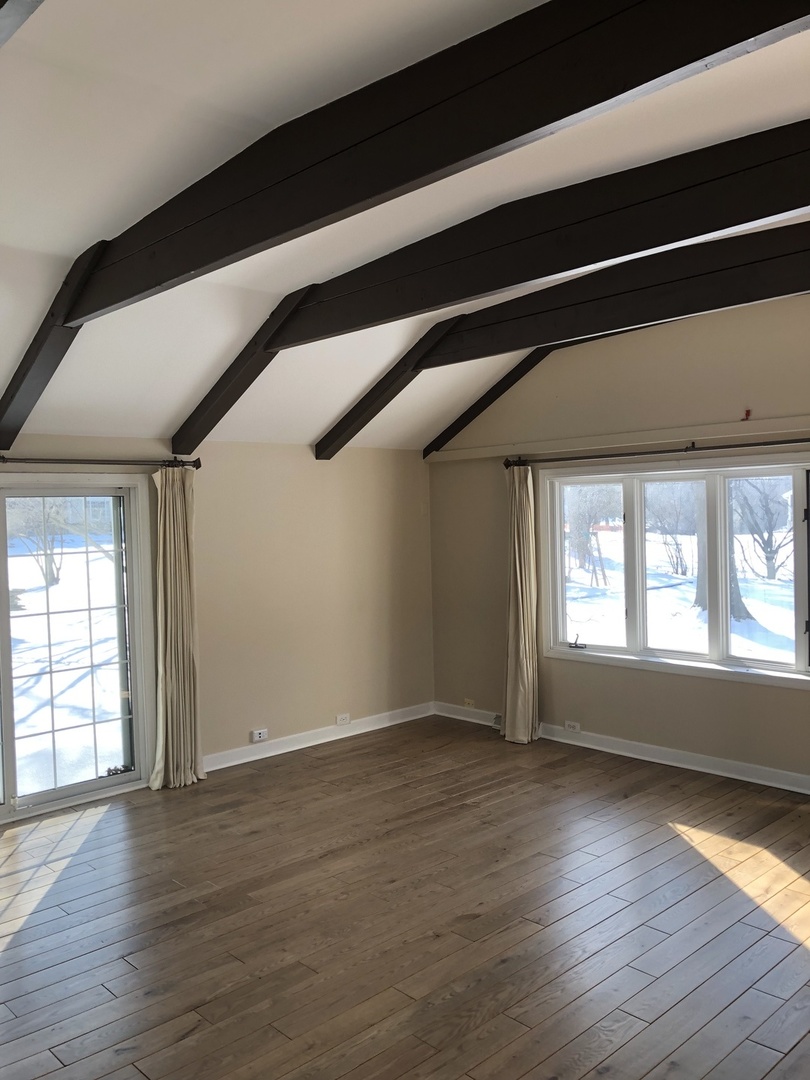1577 Banbury Road Inverness, IL 60067 - Photo 6 of 8 an empty room with wooden floor and windows
