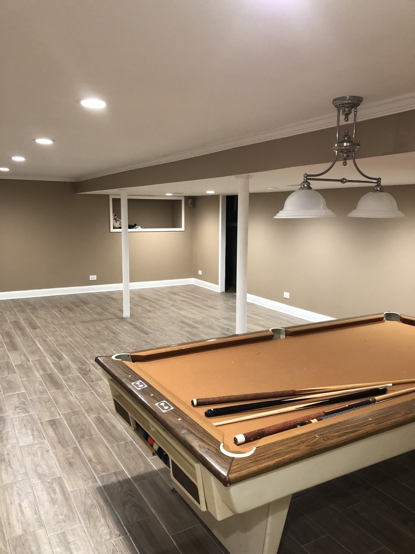 1577 Banbury Road Inverness, IL 60067 - Photo 7 of 8 a room with pool table and wooden floor