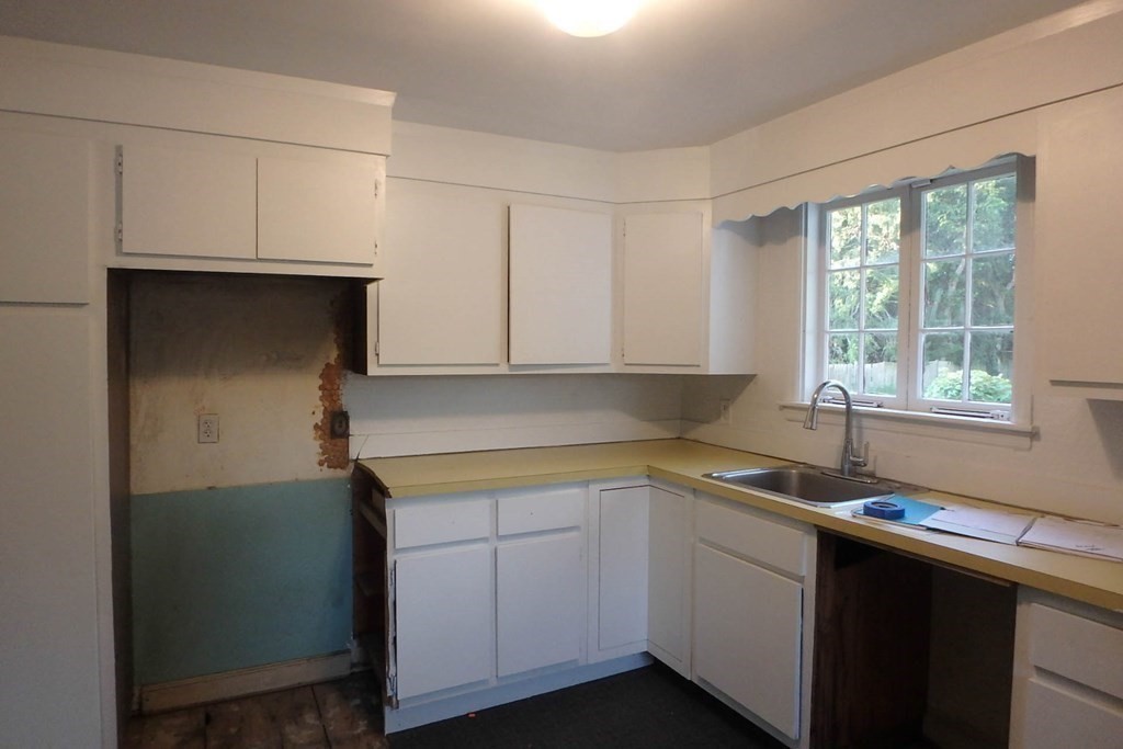 285 Andover Street Danvers, MA 01923 - Photo 14 of 20 a kitchen with a sink cabinets and window
