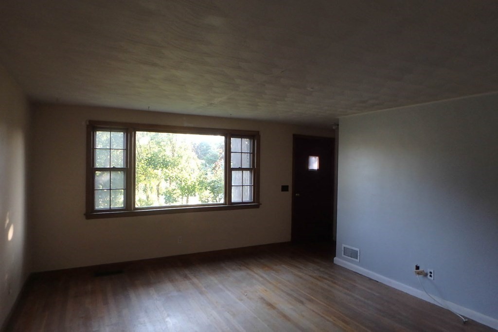 285 Andover Street Danvers, MA 01923 - Photo 15 of 20 an empty room with wooden floor and windows