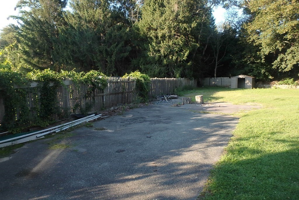 285 Andover Street Danvers, MA 01923 - Photo 2 of 20 a view of a yard with plants and large trees