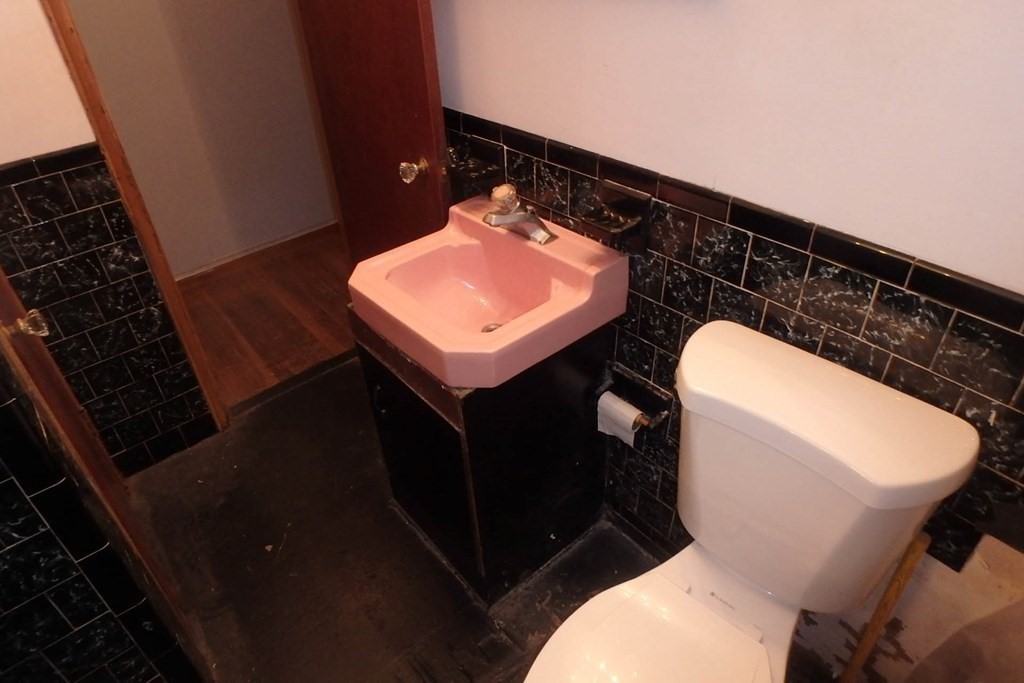 285 Andover Street Danvers, MA 01923 - Photo 5 of 20 a bathroom with a toilet and a sink