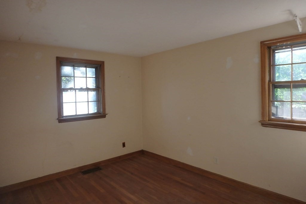 285 Andover Street Danvers, MA 01923 - Photo 8 of 20 an empty room with wooden floor and windows