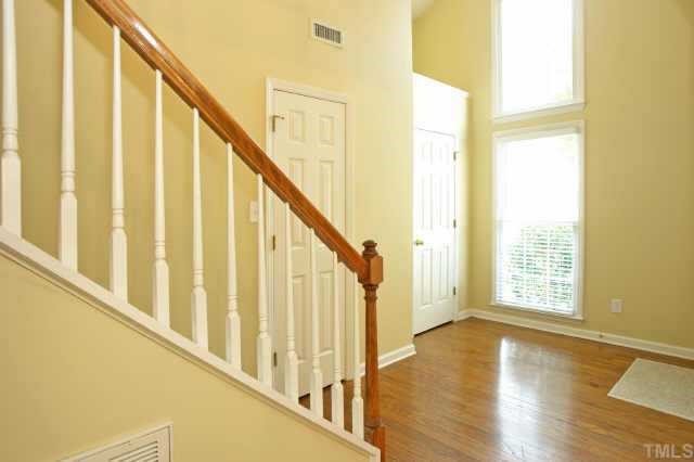 8620 Harps Mill Road Raleigh, NC 27615 - Photo 5 of 10 a view of an entryway with wooden floor