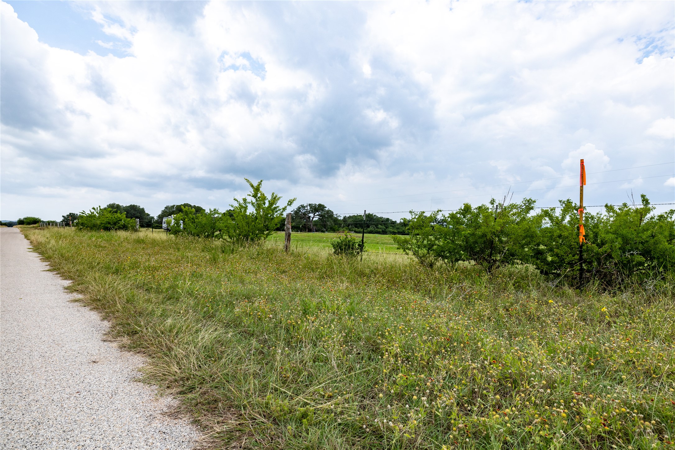 Lot 14 Concrete-Edgar Road Cuero, TX 77954 - Photo 2 of 12 a view of a lake with a big yard