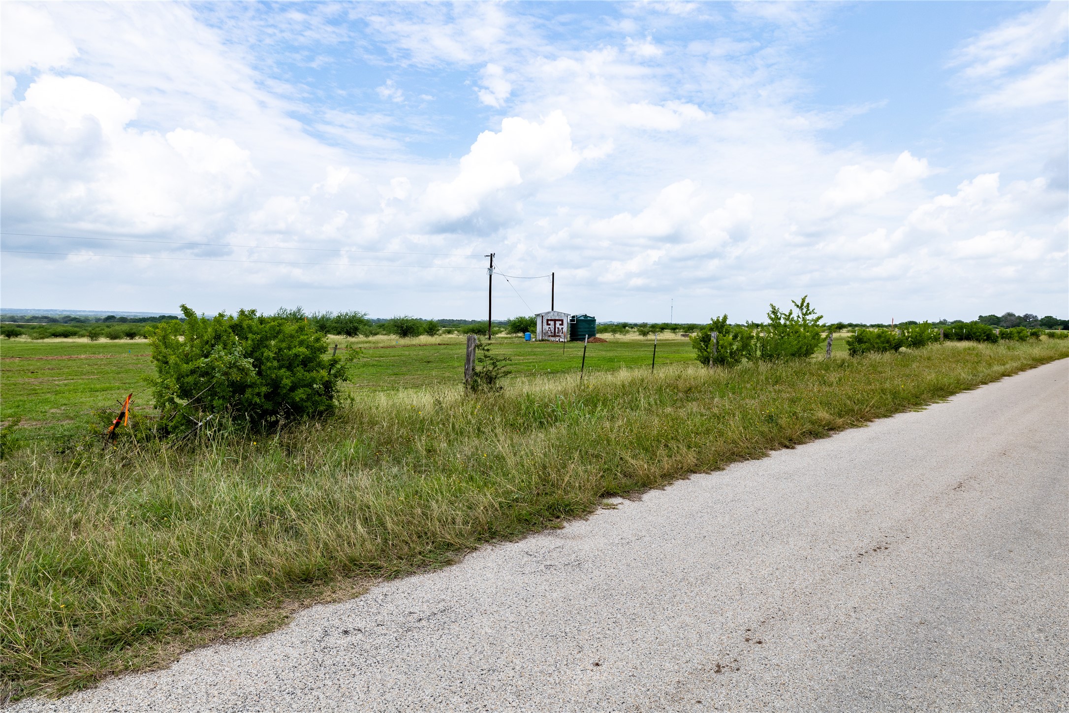 Lot 14 Concrete-Edgar Road Cuero, TX 77954 - Photo 3 of 12 a view of a lake with a big yard