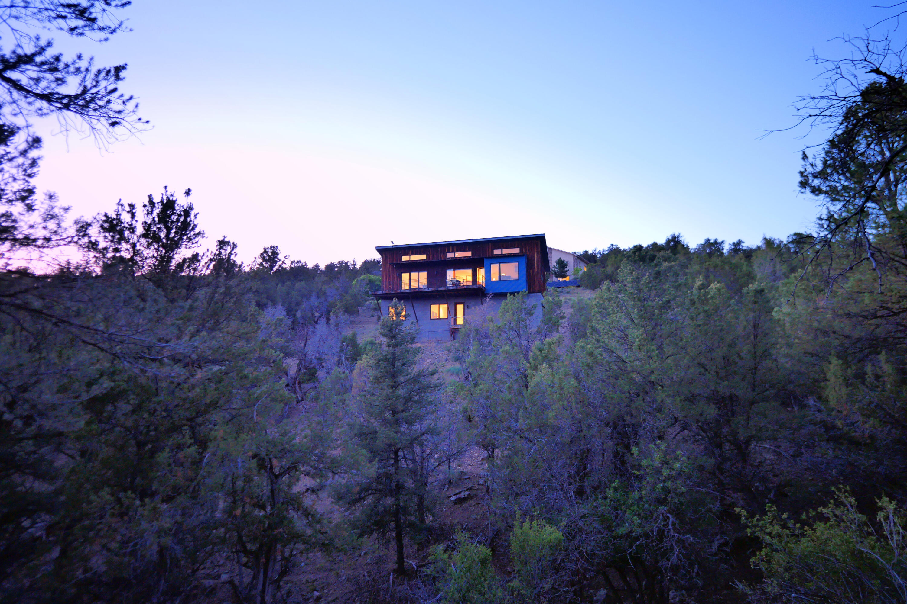 456 Ridge Road Montrose, CO 81403 - Photo 1 of 23 1 - Evening Exterior -- House Among the