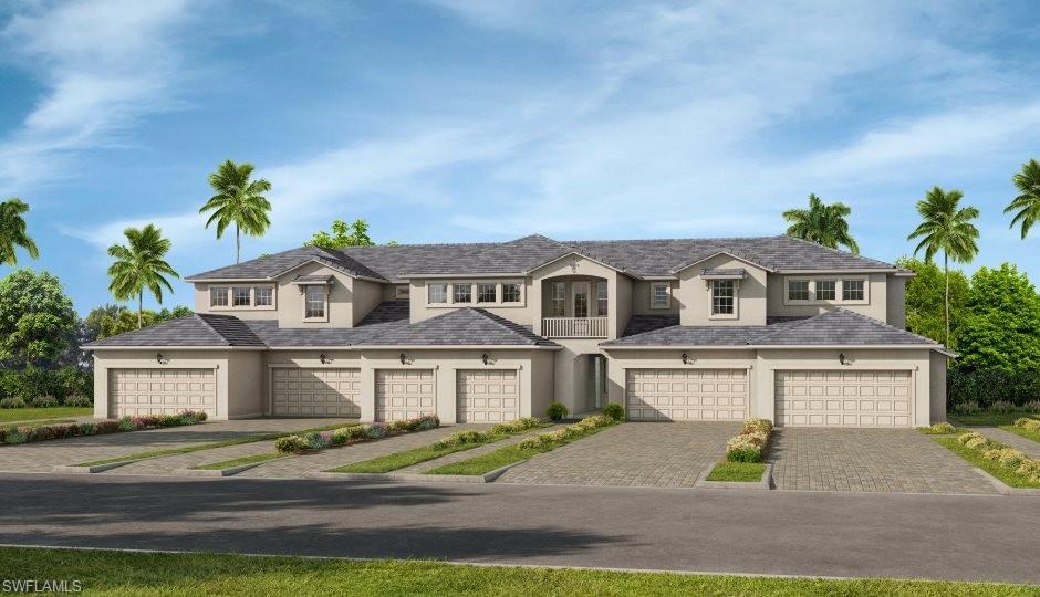 4677 Arboretum Circle, Unit 202 Naples, FL 34112 - Photo 1 of 15 a front view of a house with a yard and garage