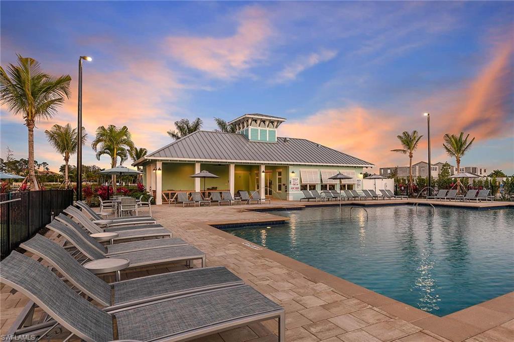 4677 Arboretum Circle, Unit 202 Naples, FL 34112 - Photo 11 of 15 a front view of a house with lake view