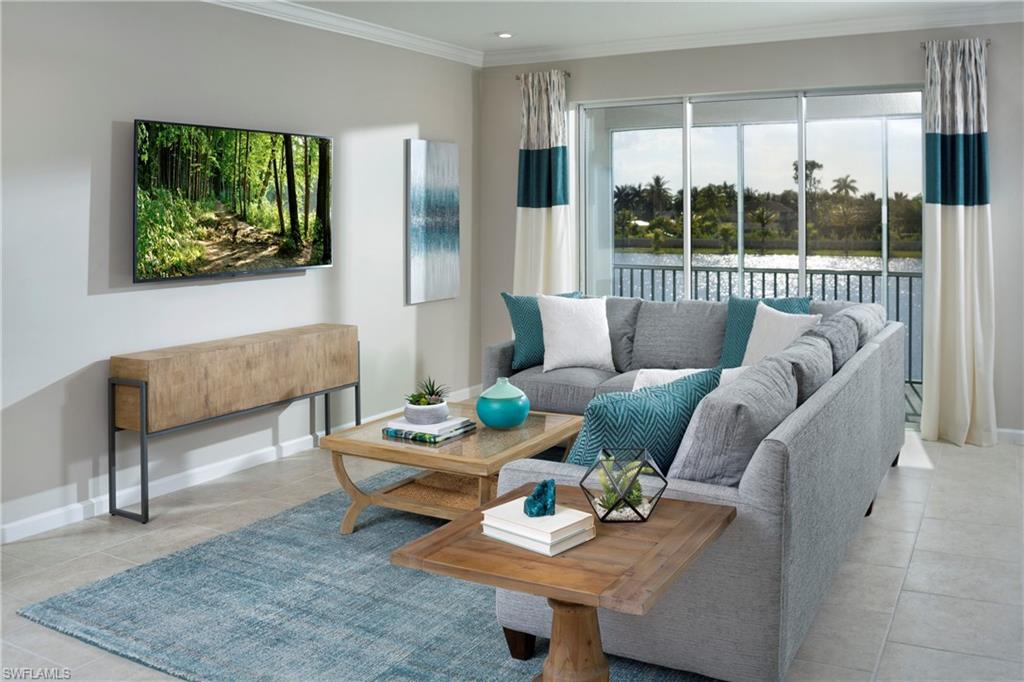 4677 Arboretum Circle, Unit 202 Naples, FL 34112 - Photo 8 of 15 a living room with furniture and a large window