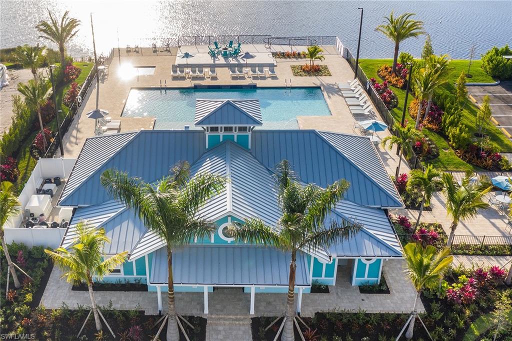 4677 Arboretum Circle, Unit 202 Naples, FL 34112 - Photo 9 of 15 a view of balcony with table and chairs
