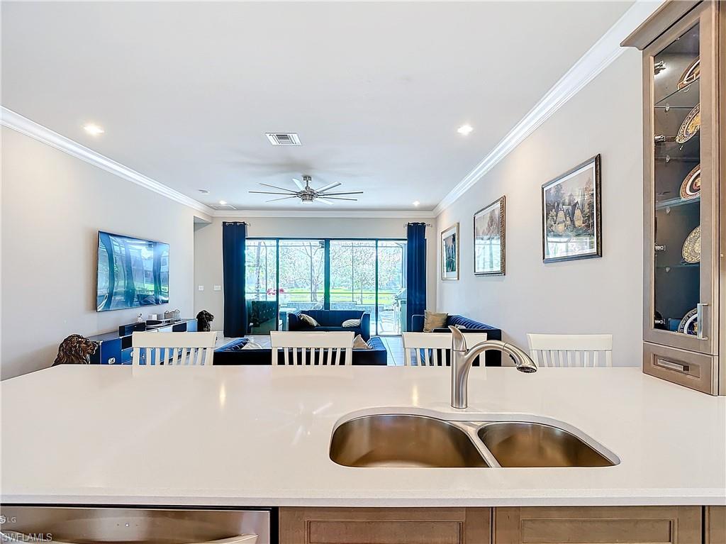 4310 Aurora Street Naples, FL 34119 - Photo 13 of 50 a living room with furniture and window