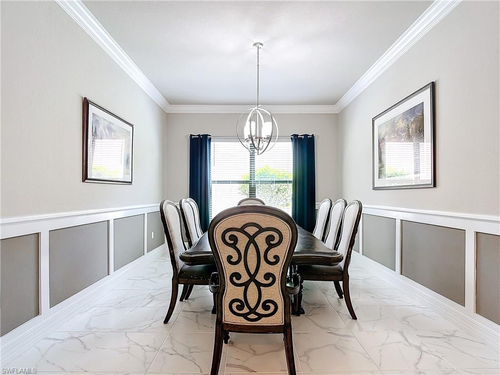 4310 Aurora Street Naples, FL 34119 - Photo 17 of 50 a view of a dining room with furniture window and outside view