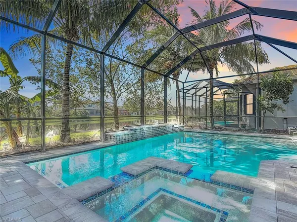 a view of a swimming pool with a patio