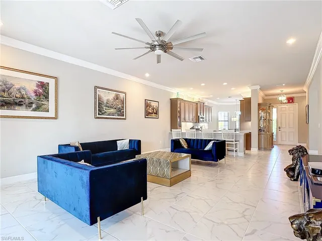 a living room with furniture and view of living room