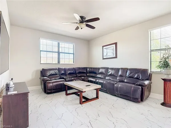 a living room with furniture and a window