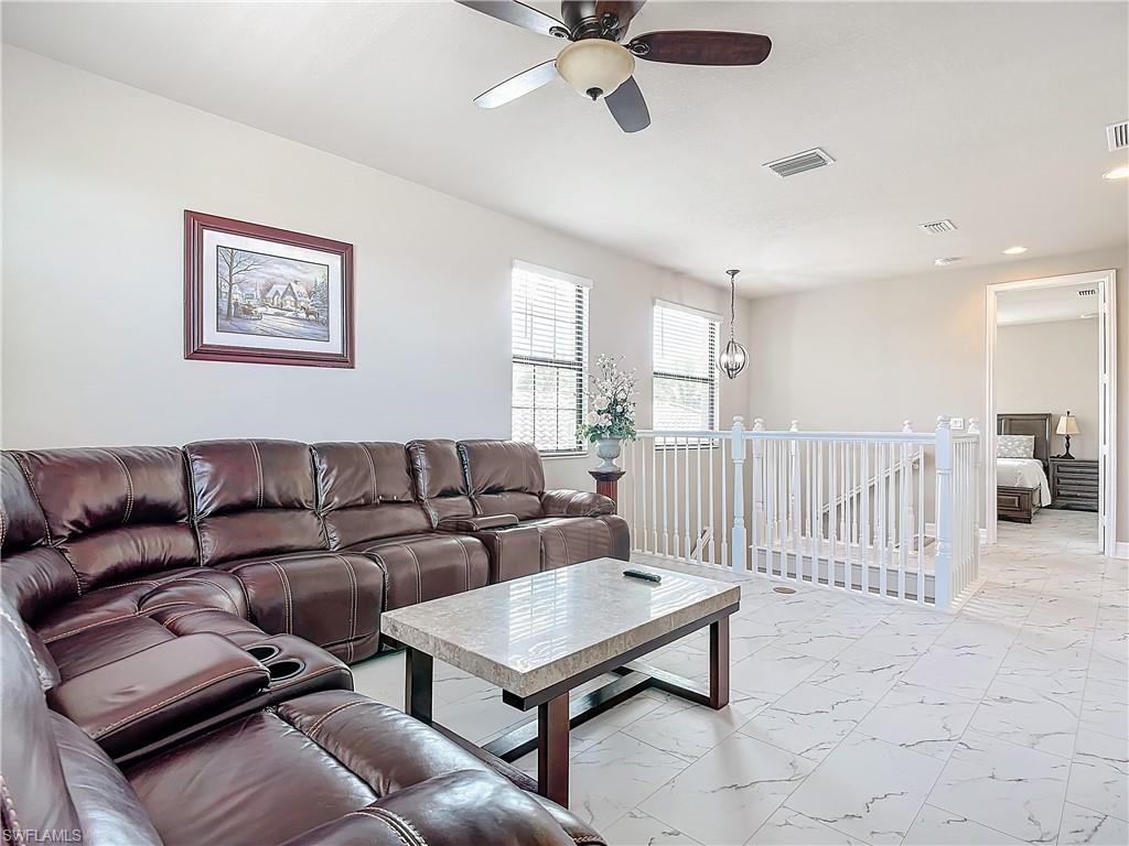 4310 Aurora Street Naples, FL 34119 - Photo 29 of 50 a living room with furniture