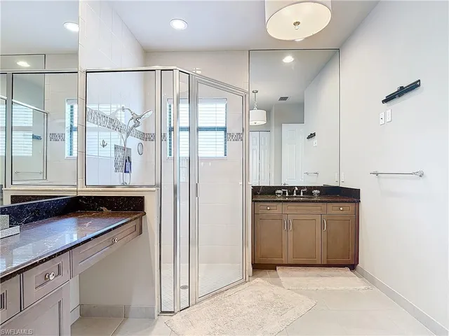 a kitchen with stainless steel appliances granite countertop a refrigerator and a stove