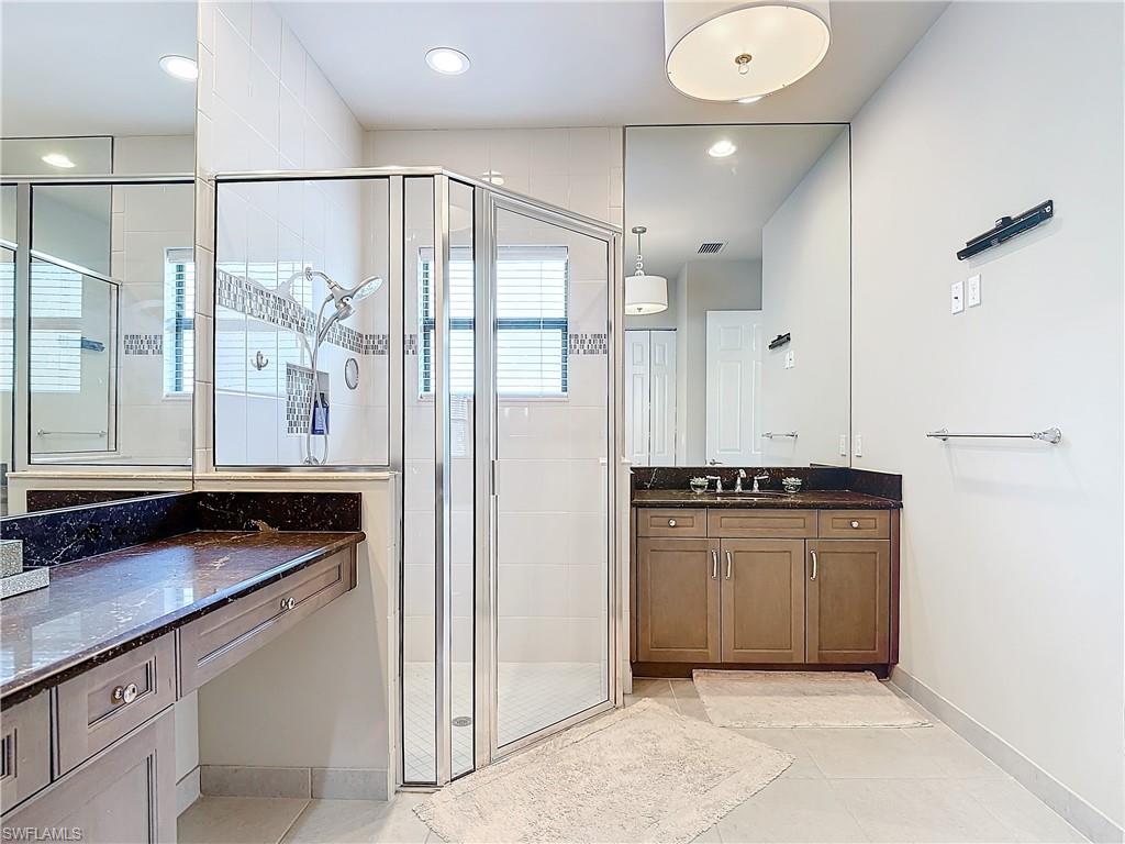4310 Aurora Street Naples, FL 34119 - Photo 37 of 50 a kitchen with stainless steel appliances granite countertop a refrigerator and a stove