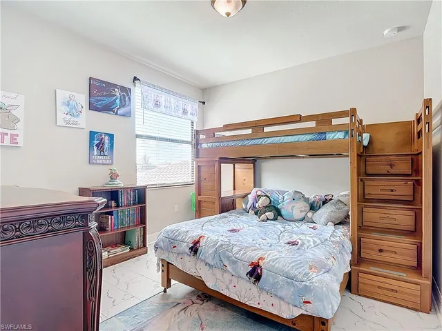 a bedroom with a bed and furniture