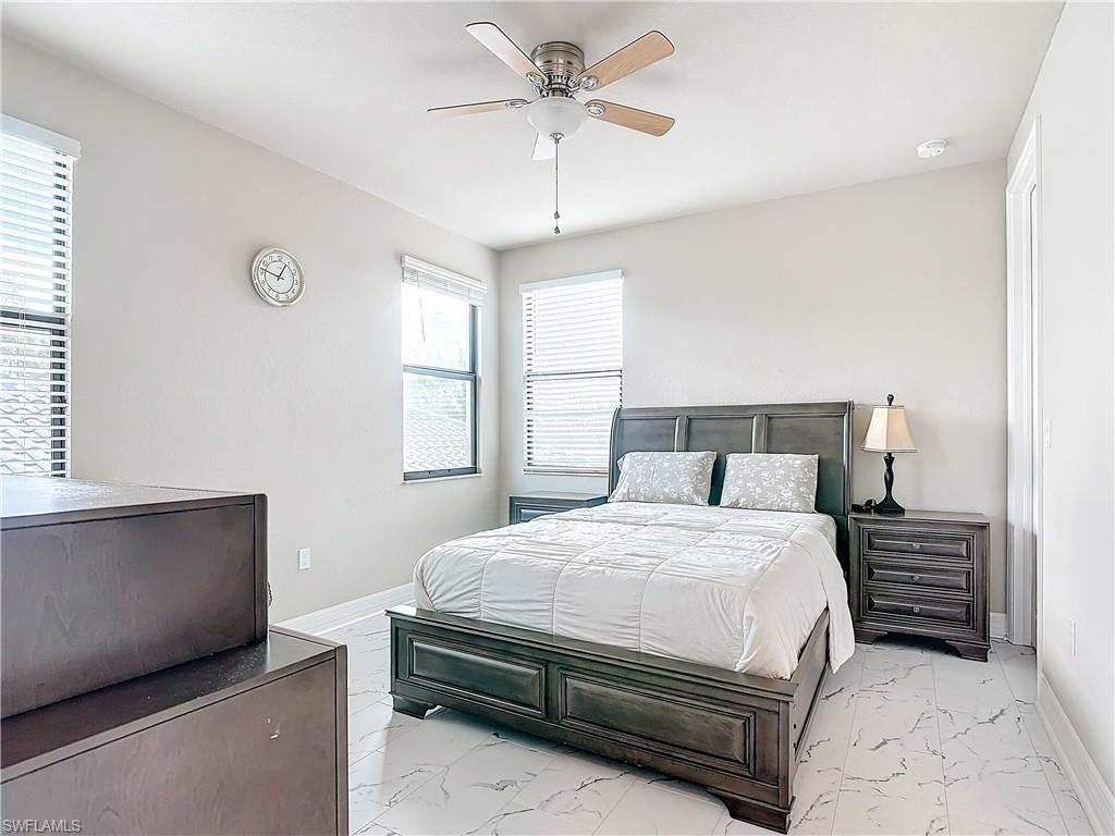 4310 Aurora Street Naples, FL 34119 - Photo 40 of 50 a bedroom with a bed and window