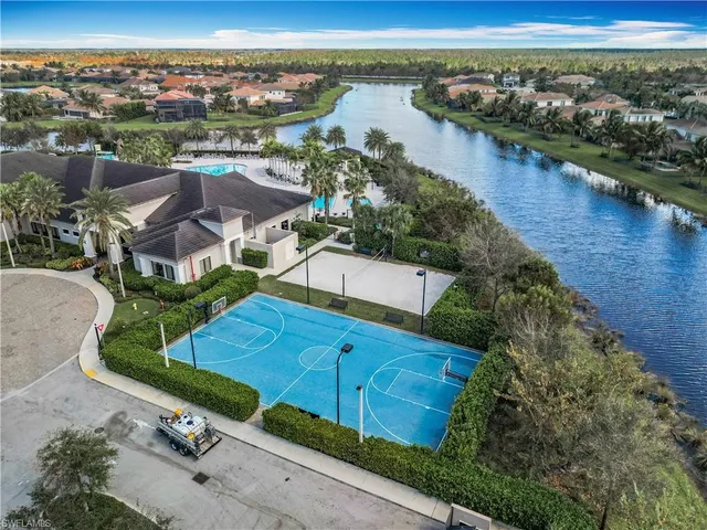 an aerial view of a house with a lake view