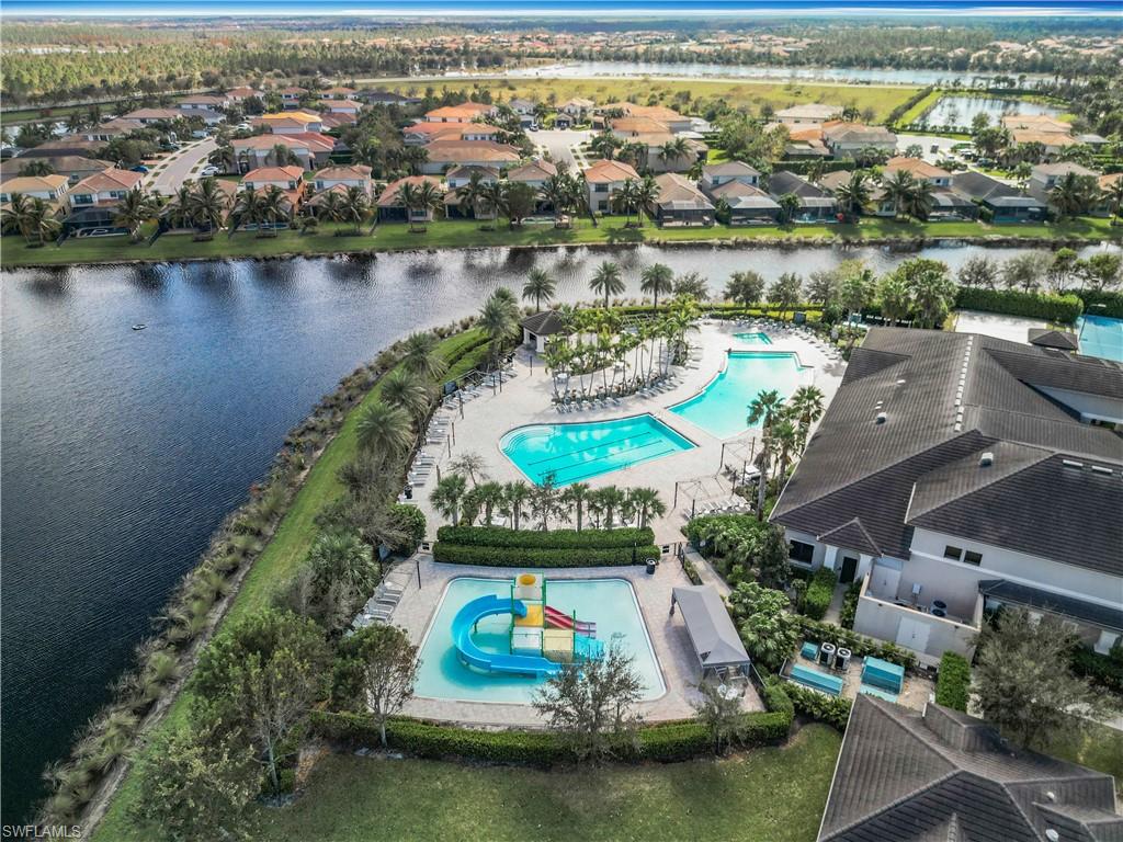 4310 Aurora Street Naples, FL 34119 - Photo 46 of 50 an aerial view of residential houses with outdoor space and lake view
