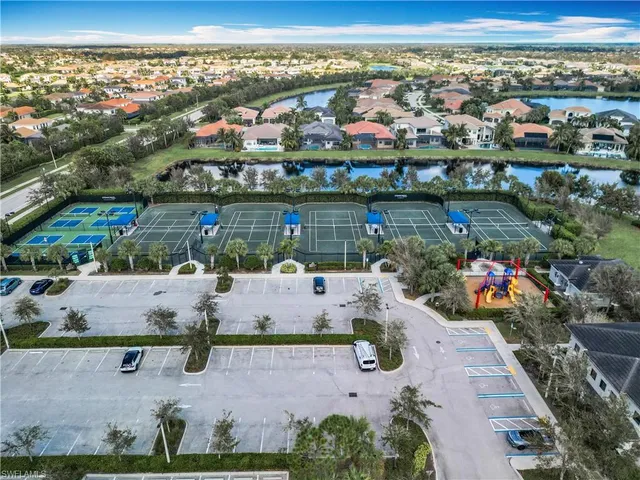 an aerial view of a house with a lake view