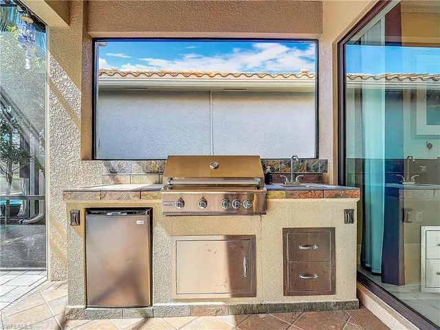 a utility room with a stove and a cabinets