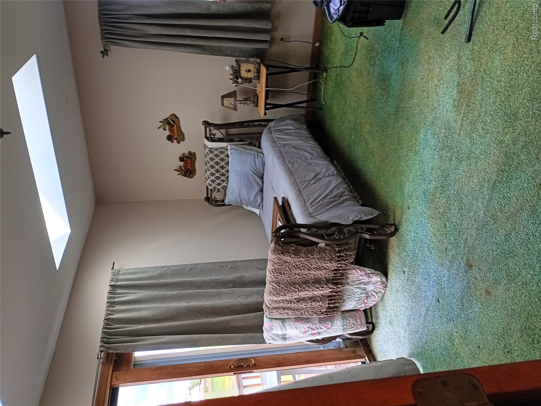 10374 Wilson Road Otisville, MI 48463 - Photo 54 of 99 Carpeted bedroom featuring a skylight and baseboards