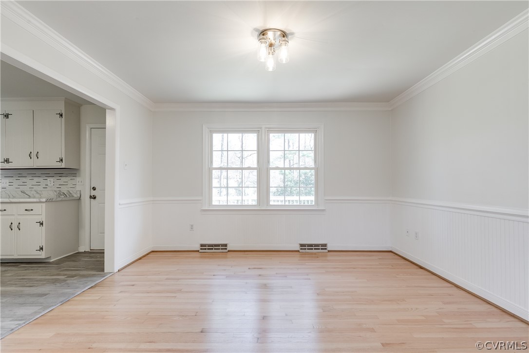 13007 Buckland Road Chester, VA 23831 - Photo 11 of 44 wooden floor in an empty room with a window