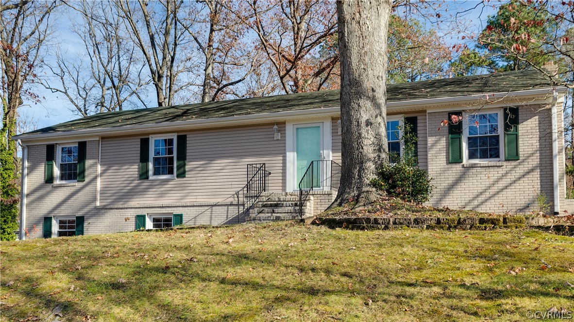 13007 Buckland Road Chester, VA 23831 - Photo 2 of 44 a house that has a tree in front of the house
