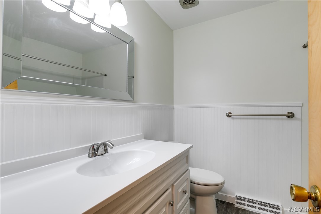 13007 Buckland Road Chester, VA 23831 - Photo 21 of 44 a bathroom with a sink a toilet and mirror
