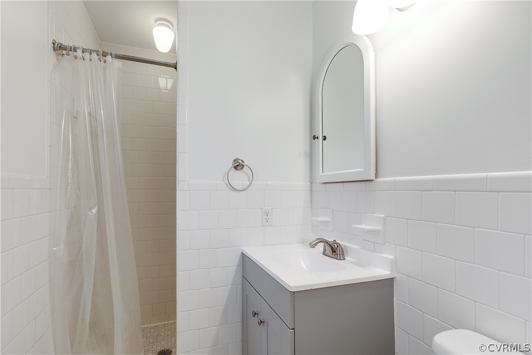 13007 Buckland Road Chester, VA 23831 - Photo 25 of 44 a bathroom with a sink a toilet and a mirror