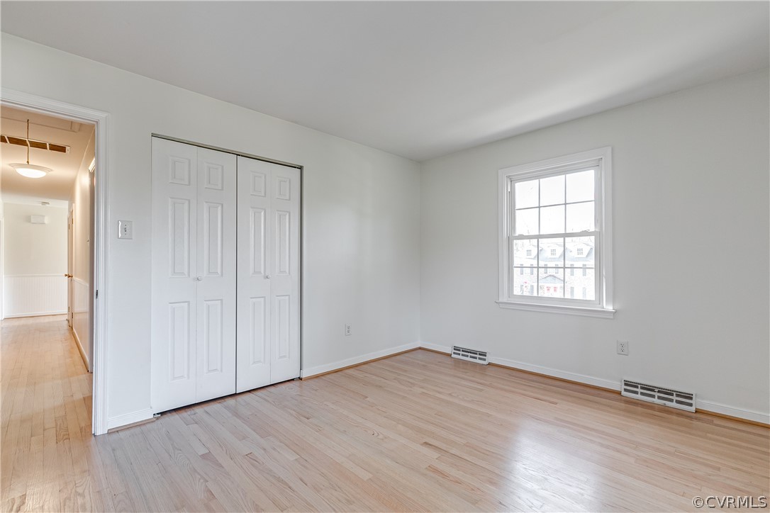 13007 Buckland Road Chester, VA 23831 - Photo 27 of 44 an empty room with wooden floor and windows
